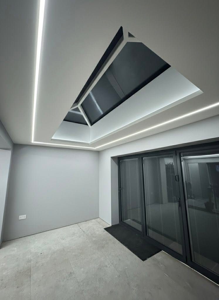 A finished O4 Plastering extension with ceiling lighting